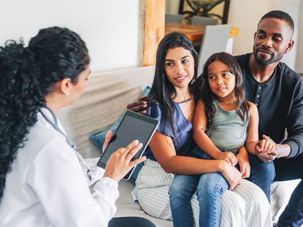 a family speaking with a doctor
